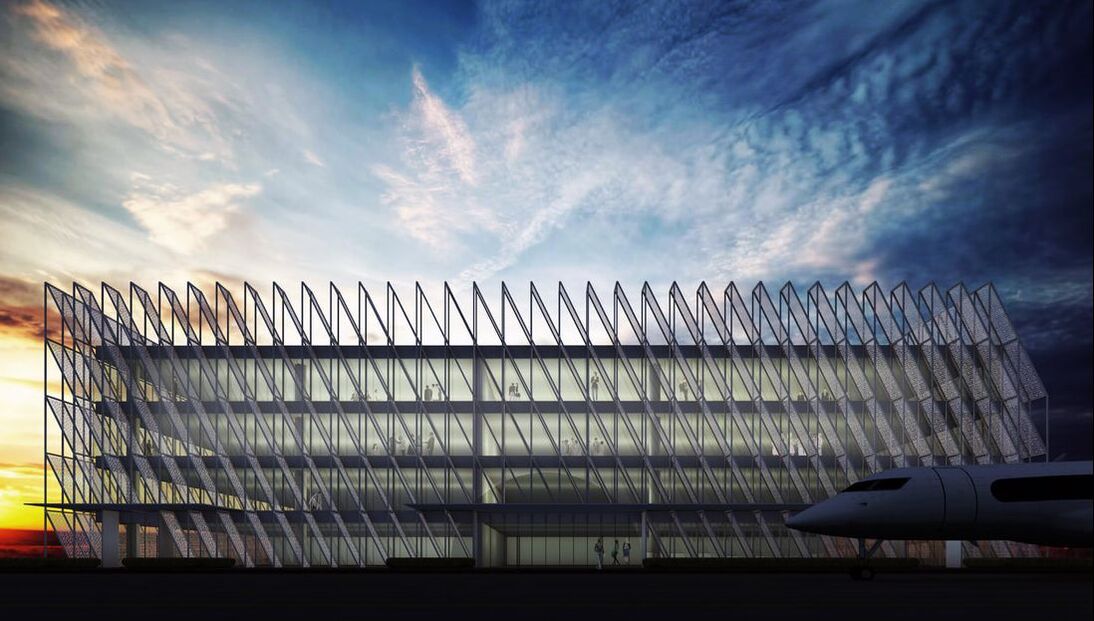 Modern airport design with white perforated façade panels with a private jet in the foreground at sunset