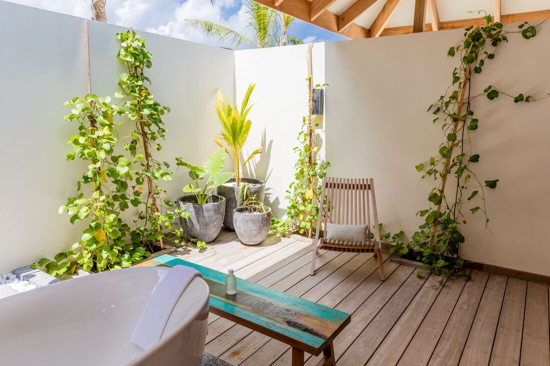 Luxury beach island resort villa with Japanese inspired natural architecture and modern outdoor shower and bathtub