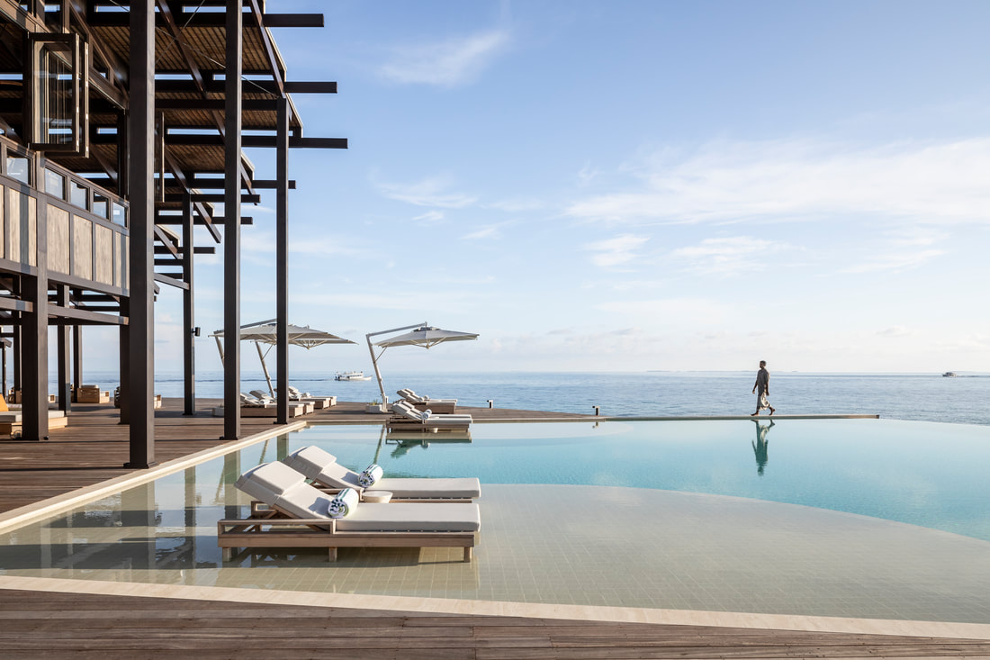 Infinity pool looking toward the ocean from a sustainable spa complex